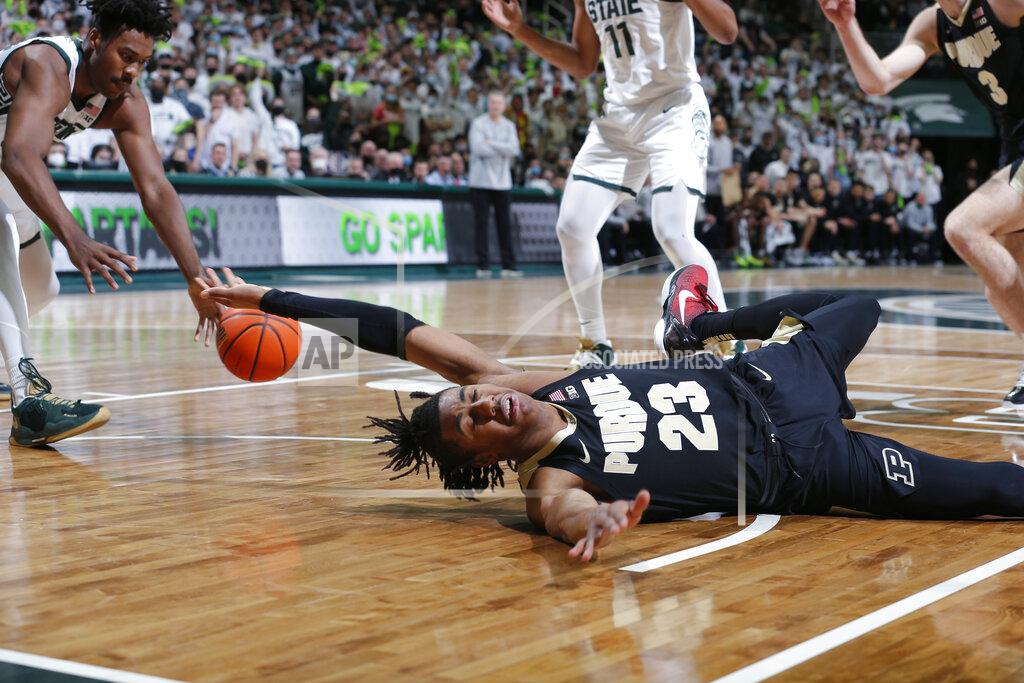 Al Goldis Purdue's Jaden Ivey, bottom, loses the ball on a drive to Michigan State's Julius Marble, left, during the first half of an NCAA college basketball game, Saturday, Feb. 26, 2022, in East Lansing, Mich. (AP Photo/Al Goldis)