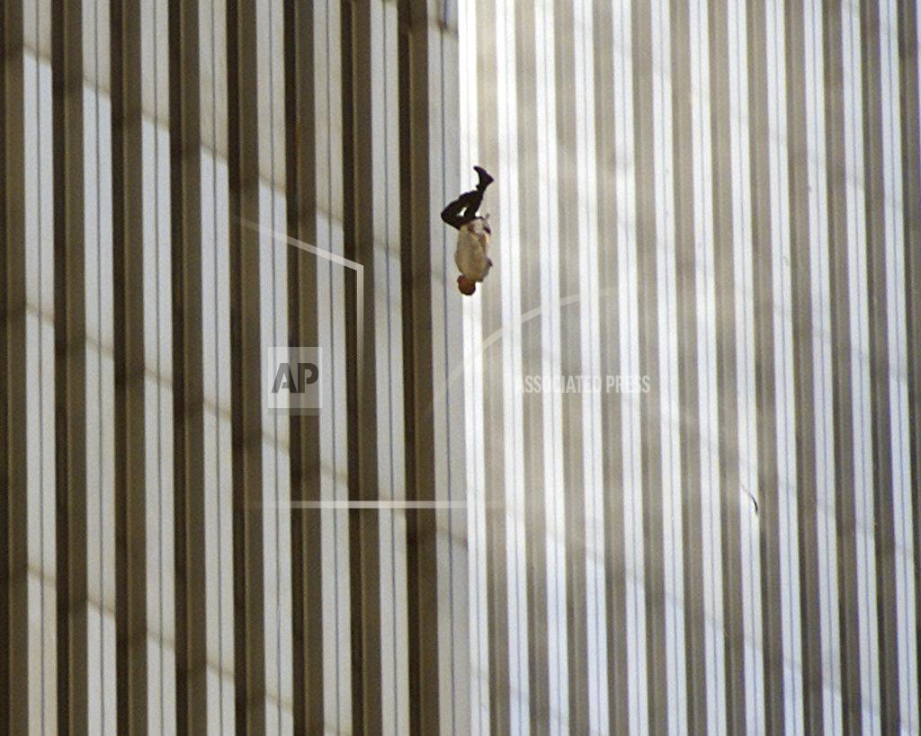 Richard Drew EDS NOTE: GRAPHIC CONTENT - FILE - A person falls from the north tower of New York's World Trade Center Tuesday Sept. 11, 2001after terrorists crashed two hijacked airliners into the World Trade Center and brought down the twin 110-story towers. Associated Press photographer Richard Drew talks about AP’s coverage of 9/11 and the events that followed. (AP Photo/Richard Drew)