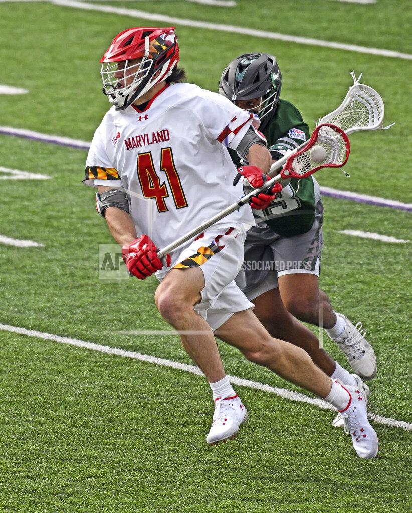 Kim Hairston Maryland's Jack Brennan charges past Loyola's Mustang Sally, before scoring on this run in the second quarter of a lacrosse match, Feb. 12, 2022 in College Park, Md.. Doctors learned early in the pandemic that COVID-19 was more than a respiratory disease. It was attacking bodily organs, including the heart — even in healthy, young athletes.(Kim Hairston/The Baltimore Sun via AP)