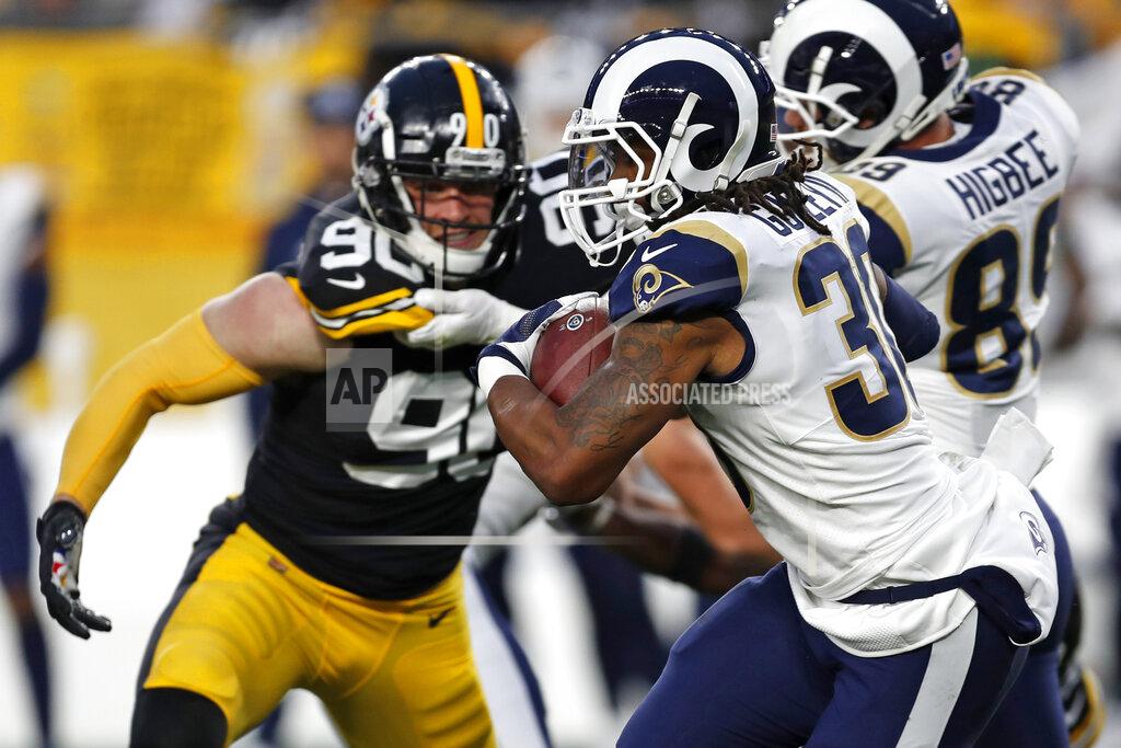Keith Srakocic Los Angeles Rams running back Todd Gurley (30) carries the football under pressure from Pittsburgh Steelers outside linebacker T.J. Watt (90) during the first half of an NFL football game in Pittsburgh, Sunday, Nov. 10, 2019. (AP Photo/Keith Srakocic)