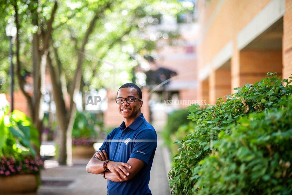 Kendra Stanley-Mills In this photo provided by Grand Valley State University, student Julian Sanders a political science major from Flint, Mich., stands for a portrait on Wednesday, May 12, 2021 in Allendale, Mich. Sanders, who was a mentor in last summer's Learner Engagement Challenge, said the solutions the students came up with would have filled a gap in his own college experience. While high school taught him how to succeed in a classroom, he said he struggled with other aspects of the college transition. (Kendra Stanley-Mills/Grand Valley State University via AP)