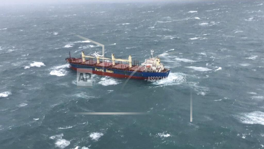 Uncredited This image from a video released from Westpac Life Saver Rescue Helicopter, shows a stranded cargo ship off Wollongong, Australia Monday, July 4, 2022. A cargo ship that left the Australian port of Wollongong on Monday morning has lost power and is drifting at sea south of Sydney with 21 crew on board. According to local media, the ship is now anchored near the coast and a tugboat is on location to try and prevent it from getting closer to nearby cliffs and rocks. (Westpac Life Saver Rescue Helicopter via AP)