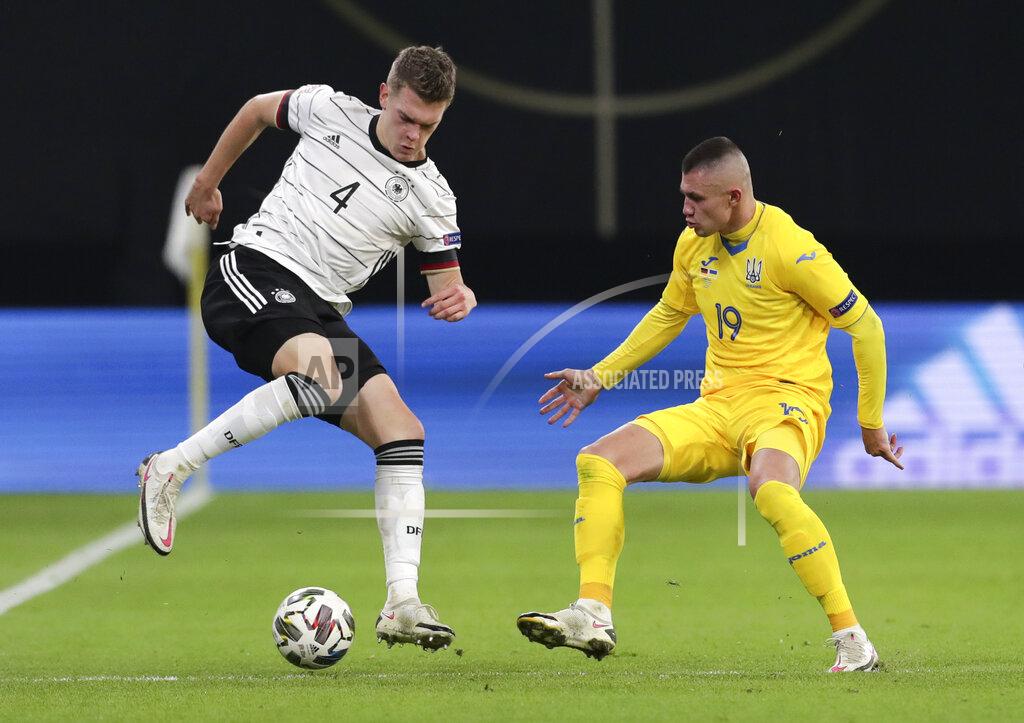 Michael Sohn Germany's Matthias Ginter, left, and Ukraine's Oleksandr Subkow compete for the ball during the UEFA Nations League soccer match between Germany and the Ukraine at the Red Bull Arena in Leipzig, Germany, Saturday, Nov. 14, 2020. (AP Photo/Michael Sohn)
