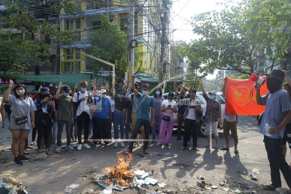 Uncredited Anti-coup protesters burn constitution books at Tarmwe township in Yangon, Myanmar Thursday April 1, 2021. Opponents of Myanmar’s military government declared the country’s 2008 constitution void and put forward an interim replacement charter late Wednesday in a major political challenge to the ruling junta. (AP Photo)