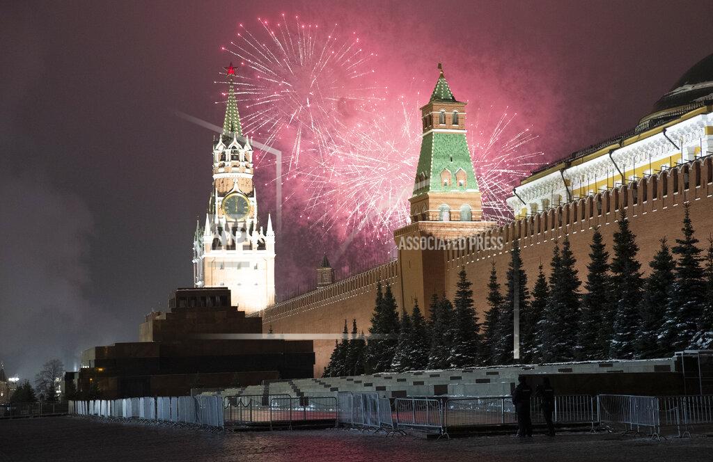 Pavel Golovkin Fireworks explode over the Kremlin and almost empty Red Square during New Year's celebrations with the Spasskaya Tower during New Year celebrations, in Moscow, Russia, Thursday, Dec. 31, 2020. (AP Photo/Pavel Golovkin)