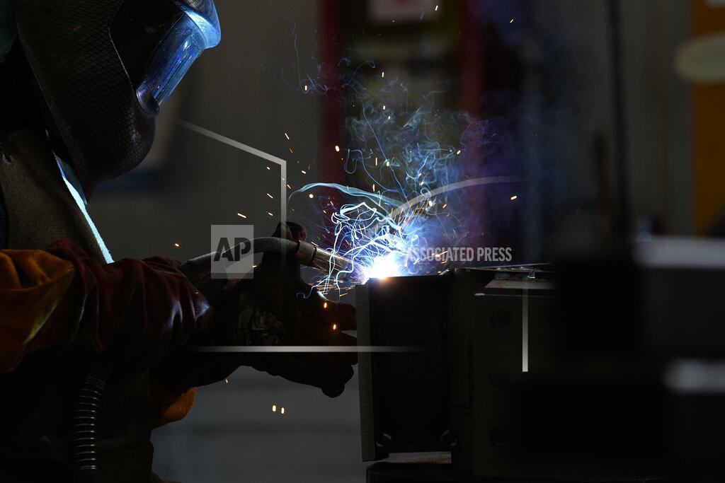 Antonio Calanni A man works at MAP, a factory operating in design, manufacture and installation of steel structures for civil and industrial use, in Corsico, near Milan, Italy, Thursday, May 12, 2022. Russia's war in Ukraine has accelerated inflation across Europe, with prices for energy, materials and food surging at rates not seen for decades. Inflation is expected to hit nearly 7% this year in the 27-nation EU and is contributing to slowing growth forecasts. (AP Photo/Antonio Calanni)