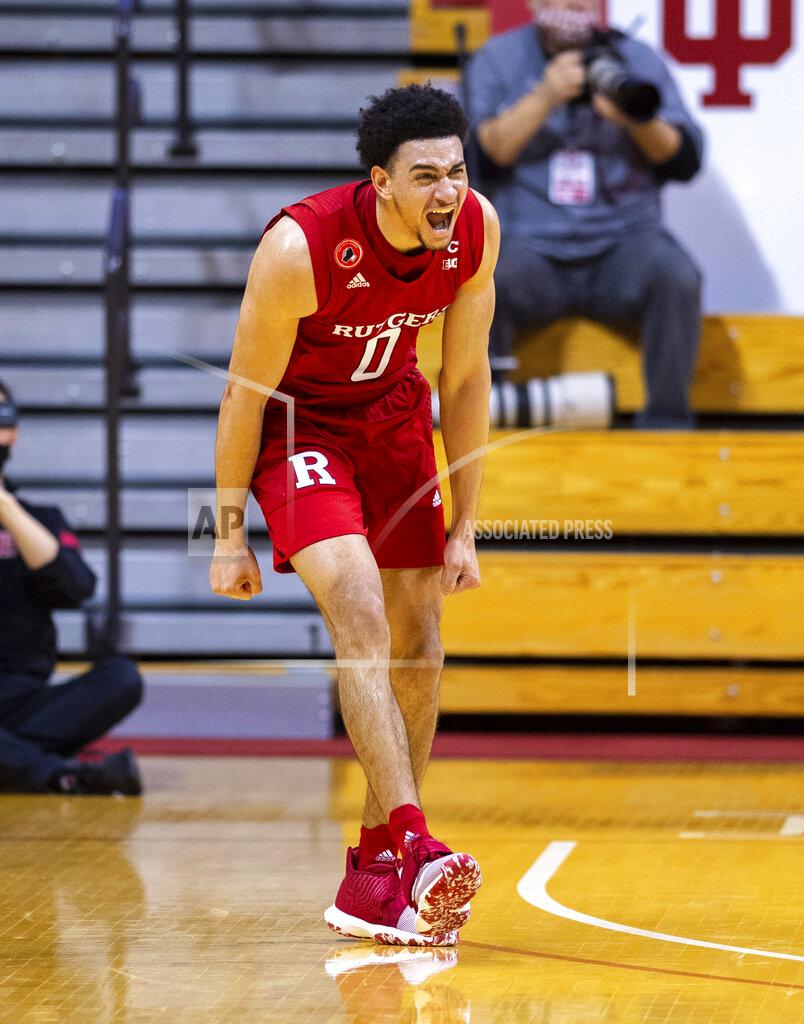 Doug Mcschooler Rutgers guard Geo Baker (0) reacts after hitting a 3-point basket during the second half of an NCAA college basketball game against Indiana, Sunday, Jan. 24, 2021, in Bloomington, Ind. (AP Photo/Doug McSchooler)