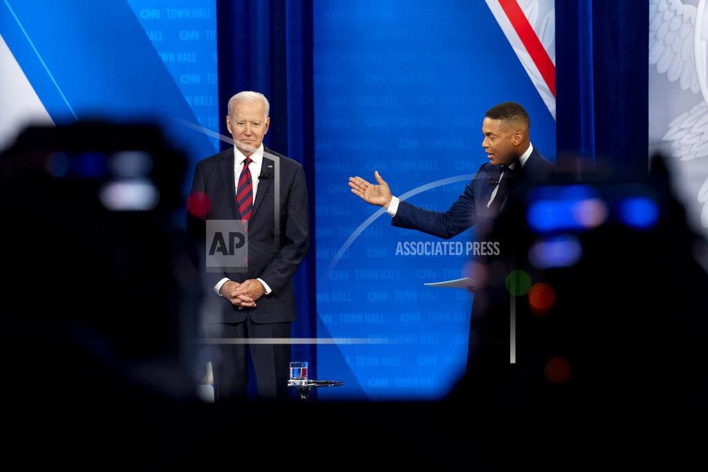 Andrew Harnik Cameras are visible in the foreground as President Joe Biden accompanied by CNN journalist Don Lemon, right, appears at a CNN town hall at Mount St. Joseph University in Cincinnati, Wednesday, July 21, 2021. (AP Photo/Andrew Harnik)