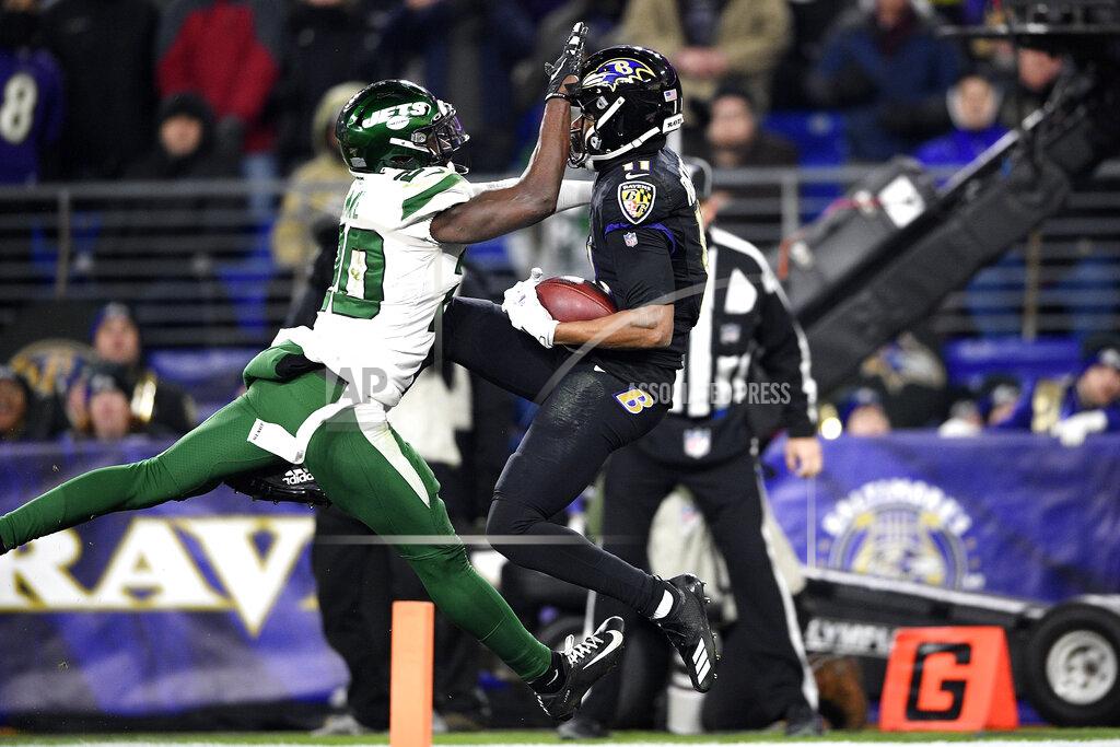 Nick Wass Baltimore Ravens wide receiver Seth Roberts, right, makes a touchdown catch on a pass from quarterback Lamar Jackson,not visible, as New York Jets free safety Marcus Maye (20) defends during the second half of an NFL football game, Thursday, Dec. 12, 2019, in Baltimore. (AP Photo/Nick Wass)