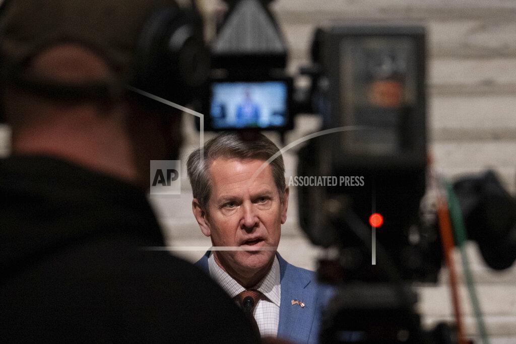Ben Gray Georgia Gov. Brian Kemp, center, holds a press conference Wednesday evening, Jan. 6, 2021, at the Georgia State Capitol in Atlanta, to condemn the breach of the U.S. Capitol. (AP Photo/Ben Gray)