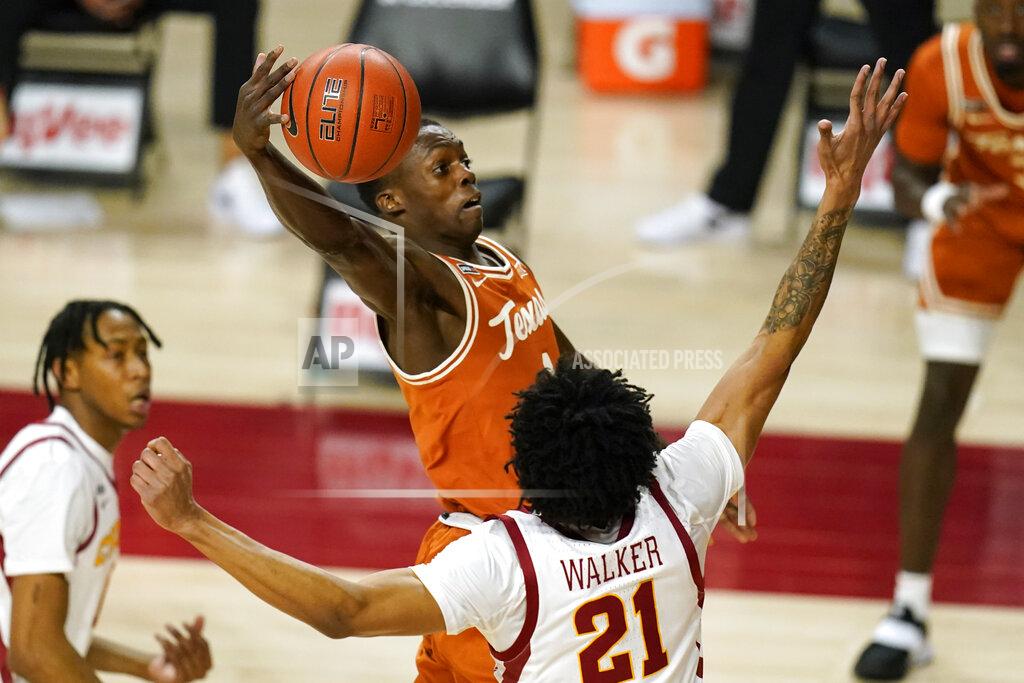 Charlie Neibergall Texas guard Andrew Jones drives to the basket over Iowa State guard Jaden Walker (21) during the first half of an NCAA college basketball game, Tuesday, March 2, 2021, in Ames, Iowa. (AP Photo/Charlie Neibergall)