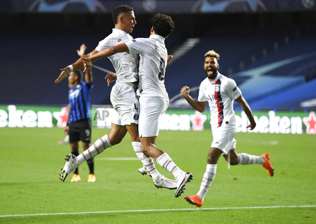 David Ramos PSG's Marquinhos, centre, celebrates with teammate Thilo Kehrer, left, after scoring his team's first goal during the Champions League quarterfinal match between Atalanta and PSG at Luz stadium, Lisbon, Portugal, Wednesday, Aug. 12, 2020. (David Ramos/Pool Photo via AP)