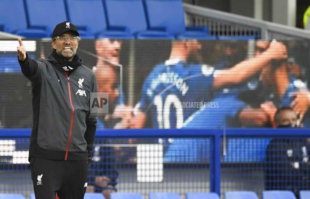 Peter Powell Liverpool's manager Jurgen Klopp shouts during the English Premier League soccer match between Everton and Liverpool at Goodison Park in Liverpool, England, Sunday, June 21, 2020. (Peter Powell/Pool via AP)