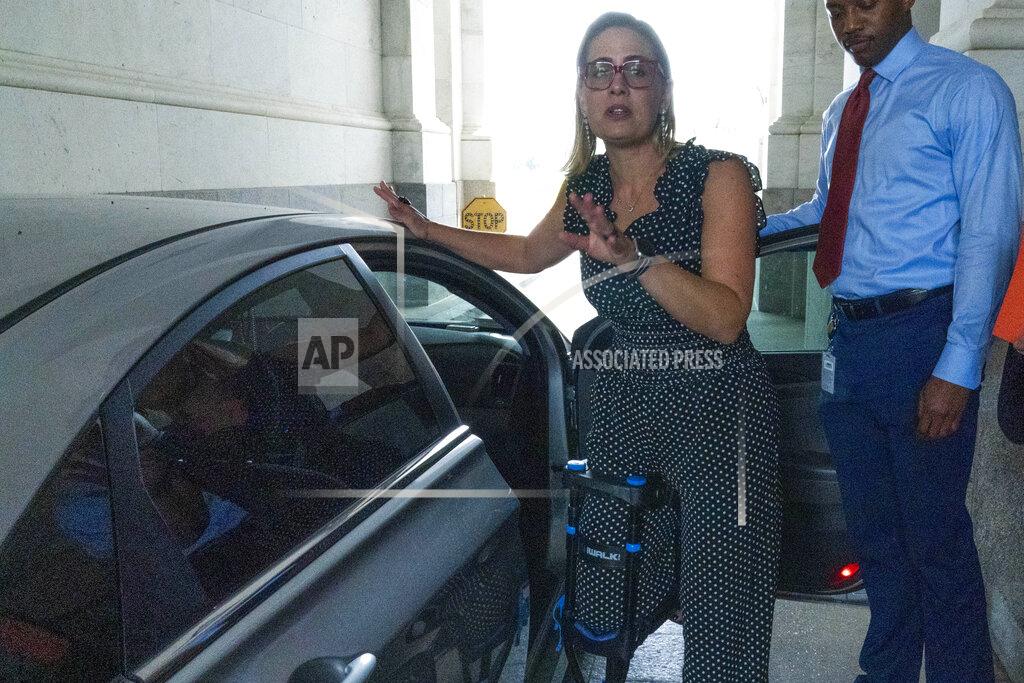 Jose Luis Magana Sen. Kyrsten Sinema, D-Ariz., leaves, after a closed door talks about infrastructure on Capitol Hill in Washington Thursday, July 15, 2021. (AP Photo/Jose Luis Magana)