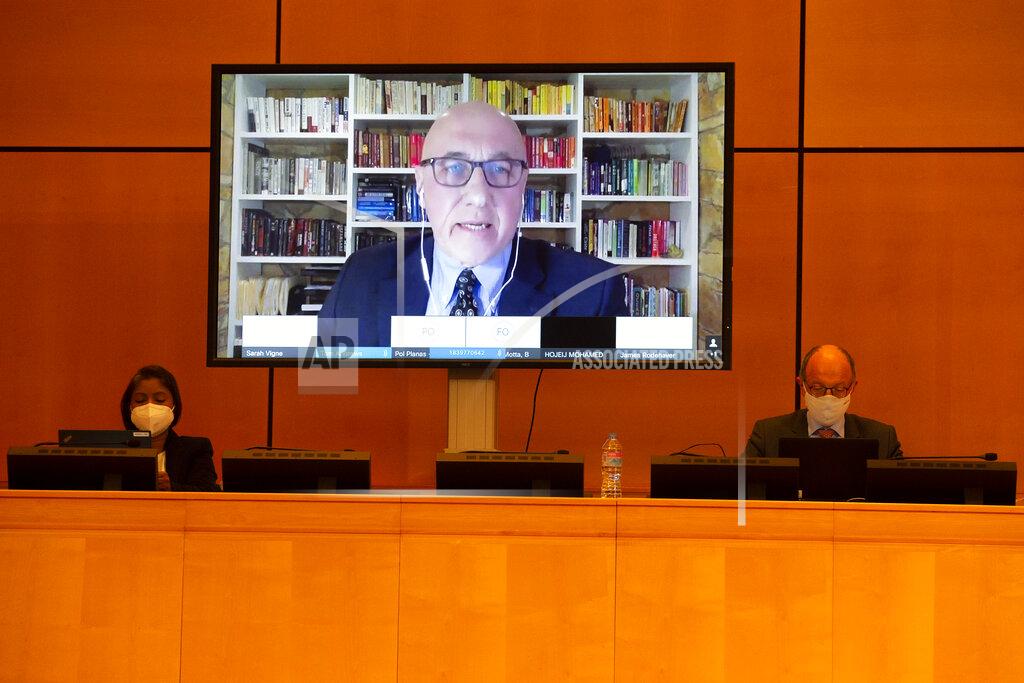 Salvatore Di Nolfi Thomas Andrews, UN Special Rapporteur on the human rights situation in Myanmar is displayed on a screen as he addresses his statement during the Human Rights Council special session on "the human rights implications of the crisis in Myanmar" at the European headquarters of the United Nations in Geneva, Switzerland, Friday, Feb. 12, 2021. The special session of the Human Rights Council on the situation in Myanmar is take in person and in virtualle due to the coronavirus pandemic. (Salvatore Di Nolfi/Keystone via AP)