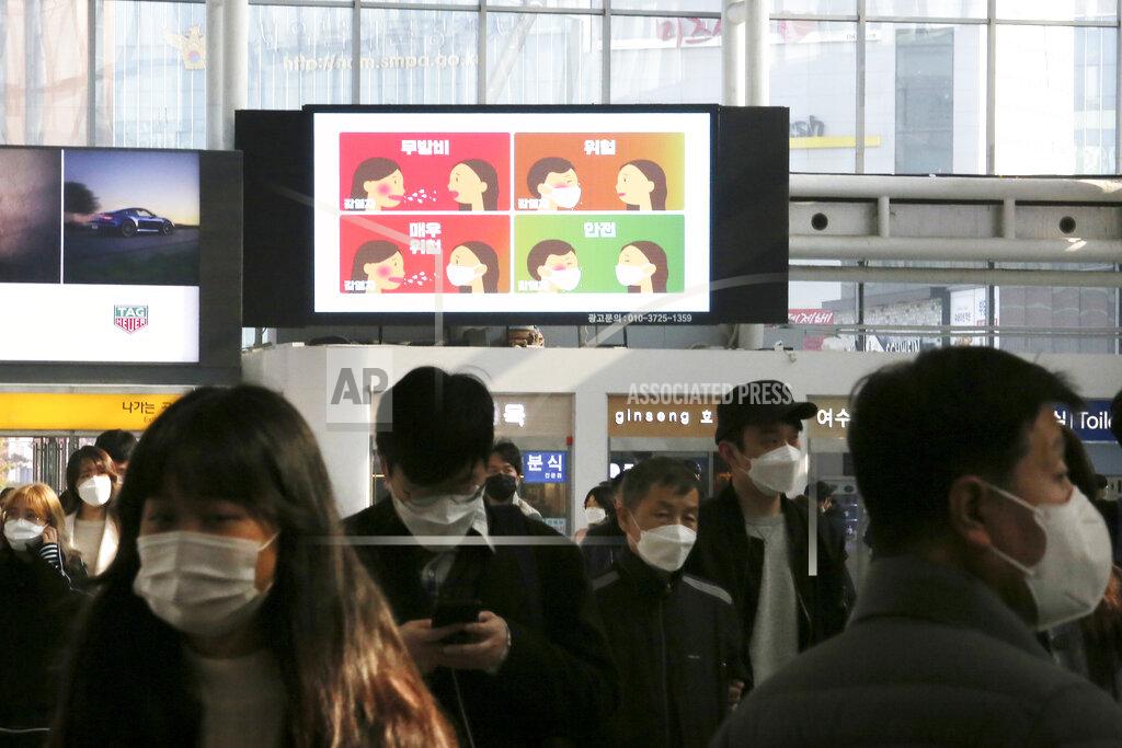 Ahn Young-Joon A screen shows precautions against the coronavirus at the Seoul Railway Station in Seoul, South Korea, Saturday, Nov. 7, 2020. The Korean letters read "Defenseless, danger and safety" (AP Photo/Ahn Young-joon)