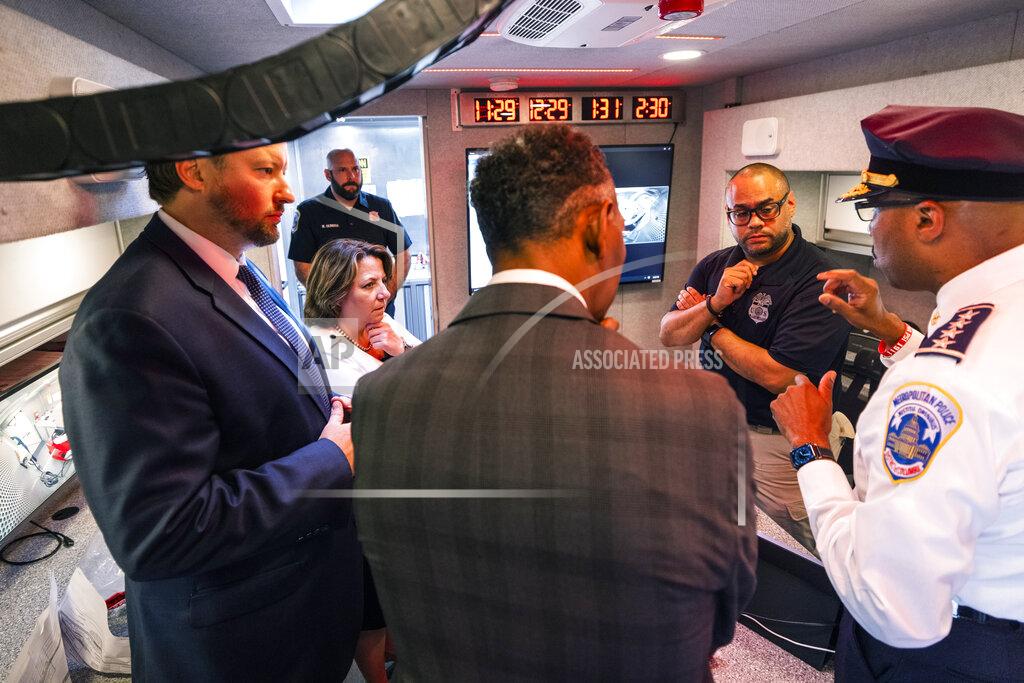 Jim Lo Scalzo Deputy Attorney General Lisa Monaco and Alcohol, Tobacco and Firearms (ATF) acting director Marvin G. Richardson, back to camera, tour an ATF crime gun intelligence mobile command center, which provides investigators with ballistic processing at crime scenes, in Washington, on Thursday, July 22, 2021. Monaco's visit comes after she and Attorney General Merrick Garland announced the launch of the Justice Department's 'five cross-jurisdictional trafficking strike forces.' The forces are aimed at reducing firearms trafficking corridors, with a focus on New York, Chicago, Los Angeles, the San Francisco Bay and Sacramento Region, and Washington. (Jim Lo Scalzo/Pool via AP)