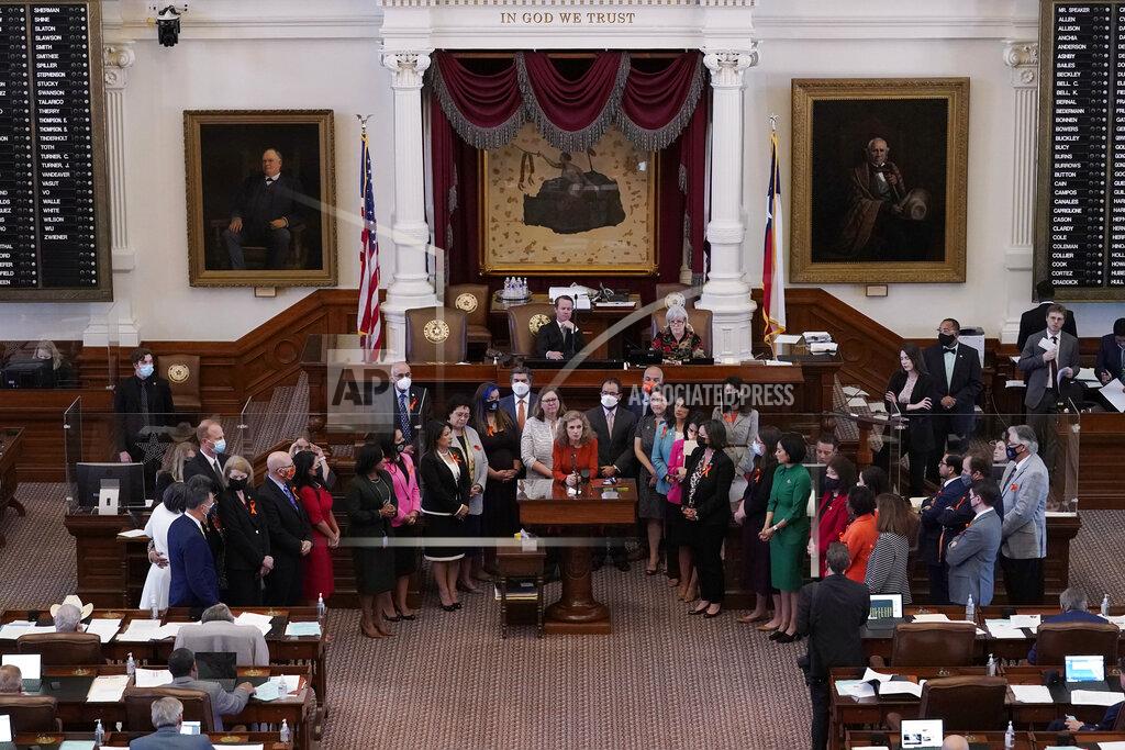 Eric Gay FILE - In this May 5, 2021, file photo, Texas state Rep. Donna Howard, D-Austin, center at lectern, stands with fellow lawmakers in the House Chamber in Austin, Texas, as she opposes a bill introduced that would ban abortions as early as six weeks and allow private citizens to enforce it through civil lawsuits, under a measure given preliminary approval by the Republican-dominated House. The law went into effect on Sept. 1. (AP Photo/Eric Gay, File)