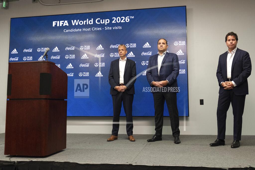 Ben Gray Colin Smith, FIFA Chief Tournaments & Events Officer, left, Victor Montagliani, FIFA vice-president and CONCACAF president, center, and Dan Corso, president of Atlanta Sports Council, listen to a question during a press conference, Friday afternoon, Sept. 17, 2021 at Mercedes-Benz Stadium in Atlanta. Officials were touring the stadium as part of the FIFA World Cup 2026 Candidate Host City Tour. (AP Photo/Ben Gray)