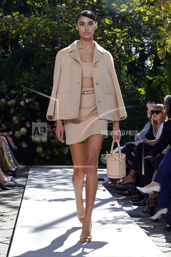 Richard Drew The Michael Kors Spring/Summer 2022 collection is modeled during Fashion Week, in New York, Friday, Sept. 10, 2021. (AP Photo/Richard Drew)
