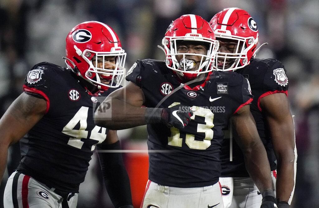 Brynn Anderson FILE - Georgia linebacker Azeez Ojulari (13) celebrates with his teammates after a sack during the second half of an NCAA college football game against Mississippi State in Athens, Ga., in this Saturday, Nov. 21, 2020, file photo. Ojulari is a possible first round pick in the NFL Draft, April 29-May 1, 2021, in Cleveland. (AP Photo/Brynn Anderson, File)
