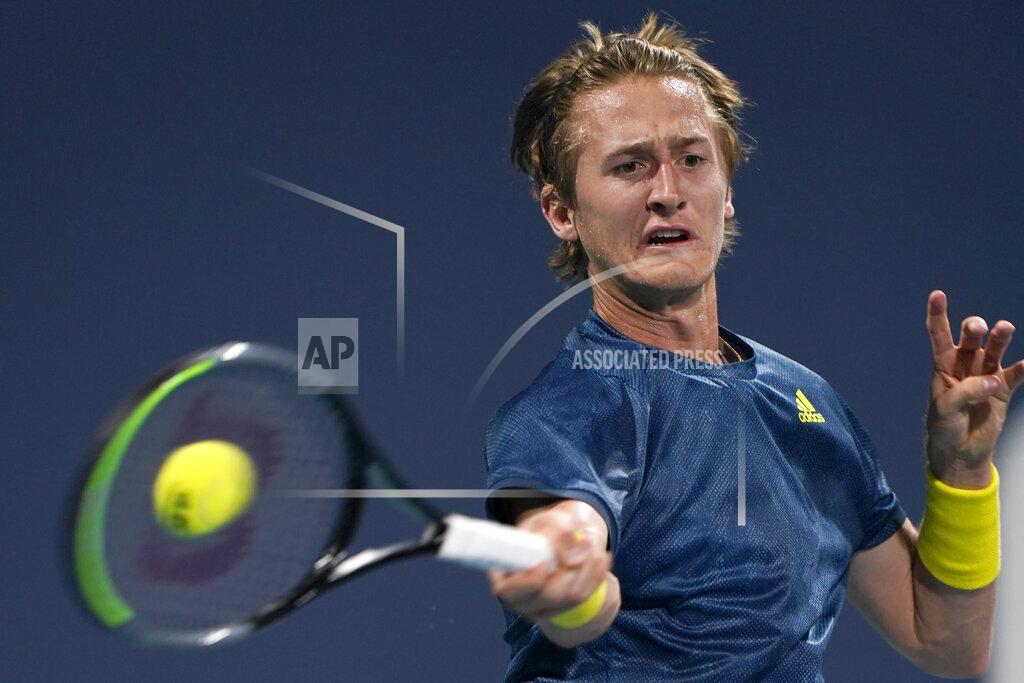 Wilfredo Lee Sebastian Korda, of the United States, returns a shot from Fabio Fognini, of Italy, during the Miami Open tennis tournament Saturday, March 27, 2021, in Miami Gardens, Fla. (AP Photo/Wilfredo Lee)