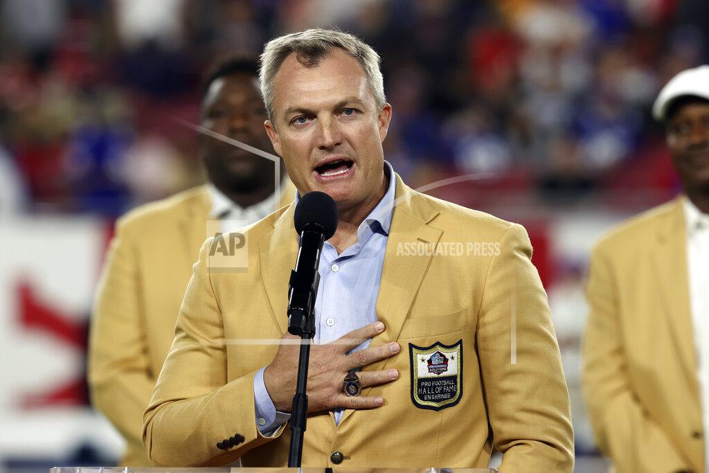 Mark Lomoglio Former Tampa Bay Buccaneers safety John Lynch speaks to the fans after being presented with his Hall of Fame ring during the first half of an NFL football game against the New York Giants Monday, Nov. 22, 2021, in Tampa, Fla. (AP Photo/Mark LoMoglio)