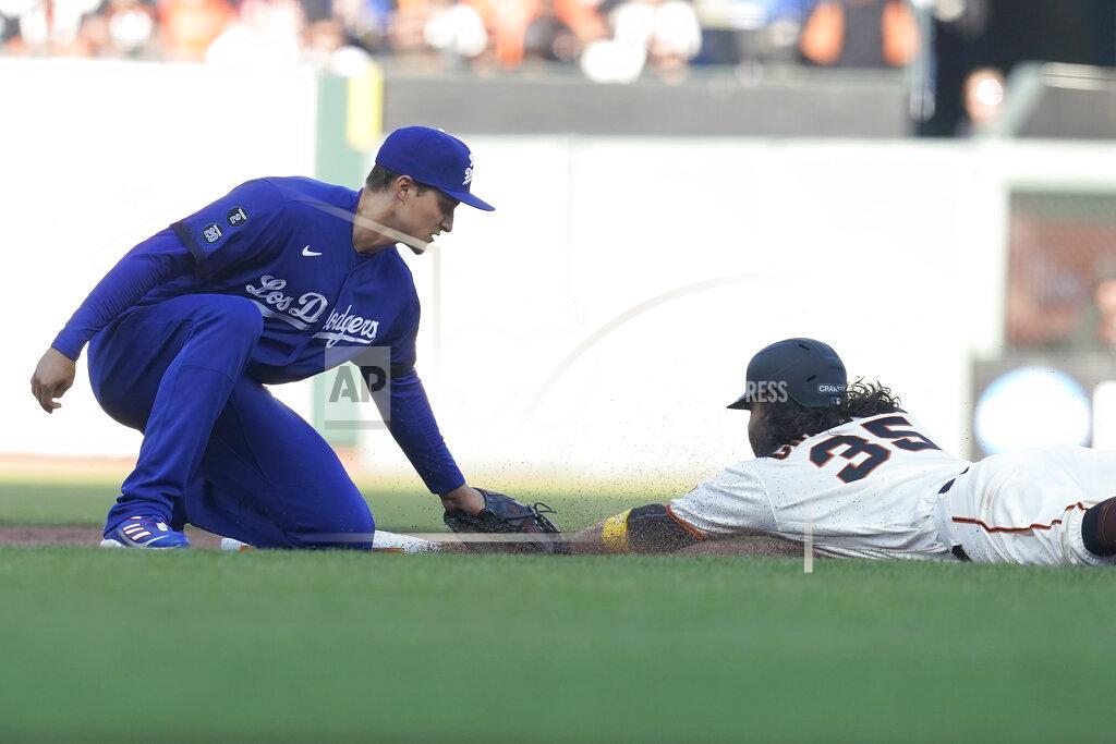 Jeff Chiu San Francisco Giants' Brandon Crawford, right, is tagged out while trying to steal second base by Los Angeles Dodgers' Corey Seager during the fifth inning of a baseball game in San Francisco, Sunday, Sept. 5, 2021. (AP Photo/Jeff Chiu)