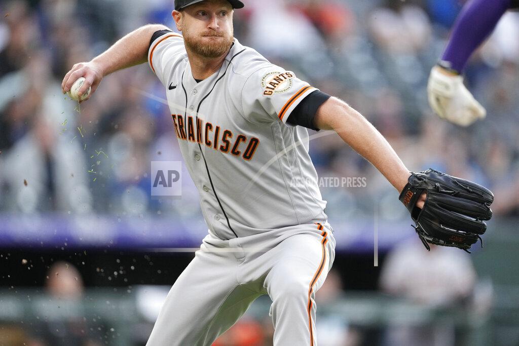 David Zalubowski San Francisco Giants starting pitcher Alex Cobb throws to first base to put out Colorado Rockies' Ryan McMahon in the second inning of a baseball game Tuesday, May 17, 2022, in Denver. (AP Photo/David Zalubowski)