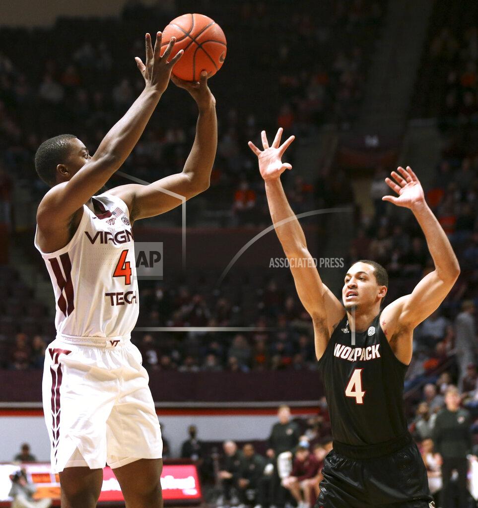 Matt Gentry Virginia Tech's Nahiem Alleyne (4) shoots over North Carolina State's Jericole Hellems (4) in the first half of an NCAA college basketball game Tuesday, Jan. 4, 2022, in Blacksburg, Va. (Matt Gentry/The Roanoke Times via AP)