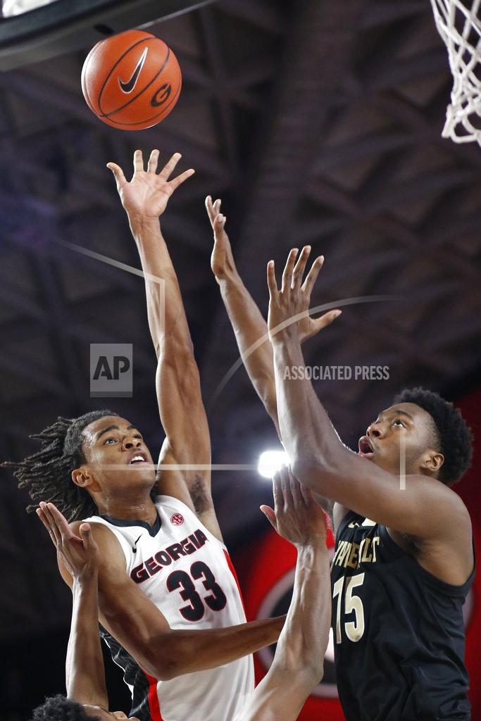Joshua L. Jones Georgia forward Nicolas Claxton (33) takes a shot while being defended by Vanderbilt forward Aaron Nesmith (24) and Vanderbilt forward Clevon Brown (15) during an NCAA college basketball game, Wednesday, Jan. 9, 2019 in Athens, Ga. (Joshua L. Jones/Athens Banner-Herald via AP)