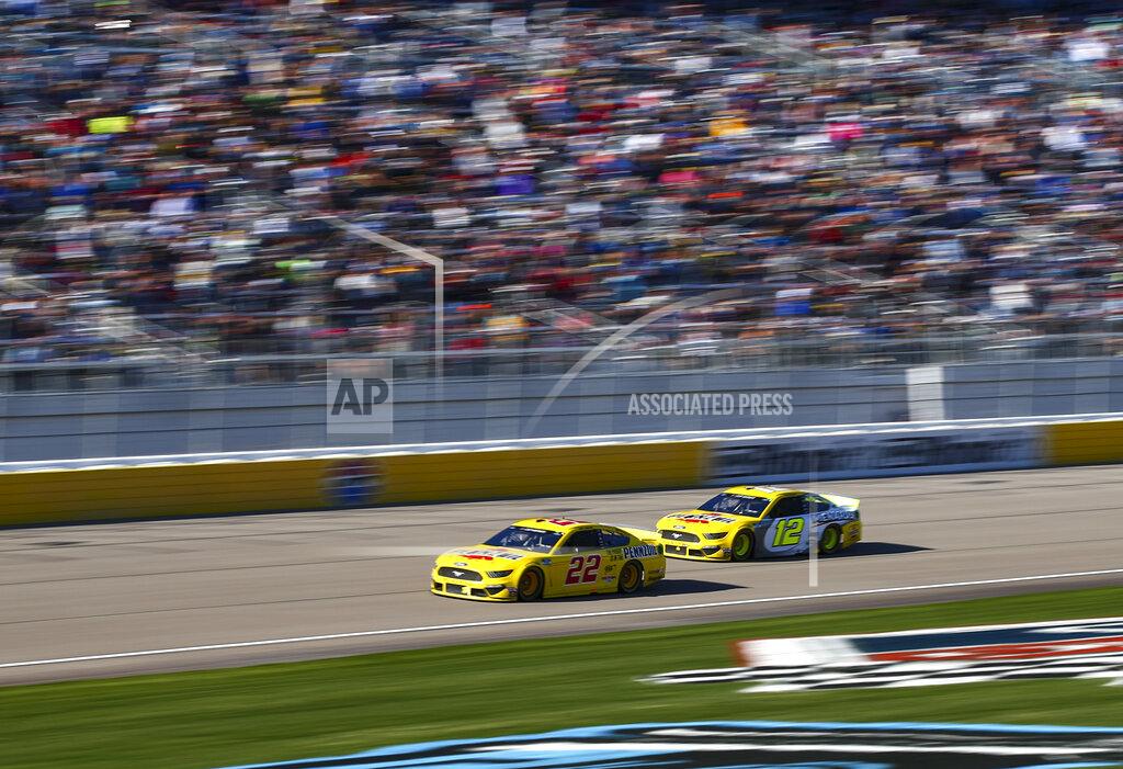 Chase Stevens Joey Logano (22) and Ryan Blaney (12) drive during a NASCAR Cup Series auto race at the Las Vegas Motor Speedway on Sunday, Feb. 23, 2020. (AP Photo/Chase Stevens)