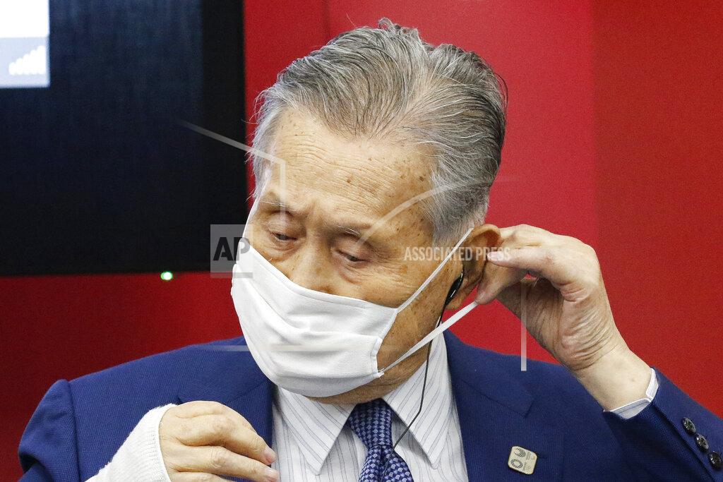 President of Tokyo 2020 Yoshiro Mori wears a face mask before he leaves a joint press conference between the International Olympic Committee (IOC) and Tokyo Organizing Committee of the Olympic and Paralympic Games (Tokyo 2020) Friday, Sept. 25, 2020, in Tokyo. (Rodrigo Reyes Marin/Pool Photo via AP)