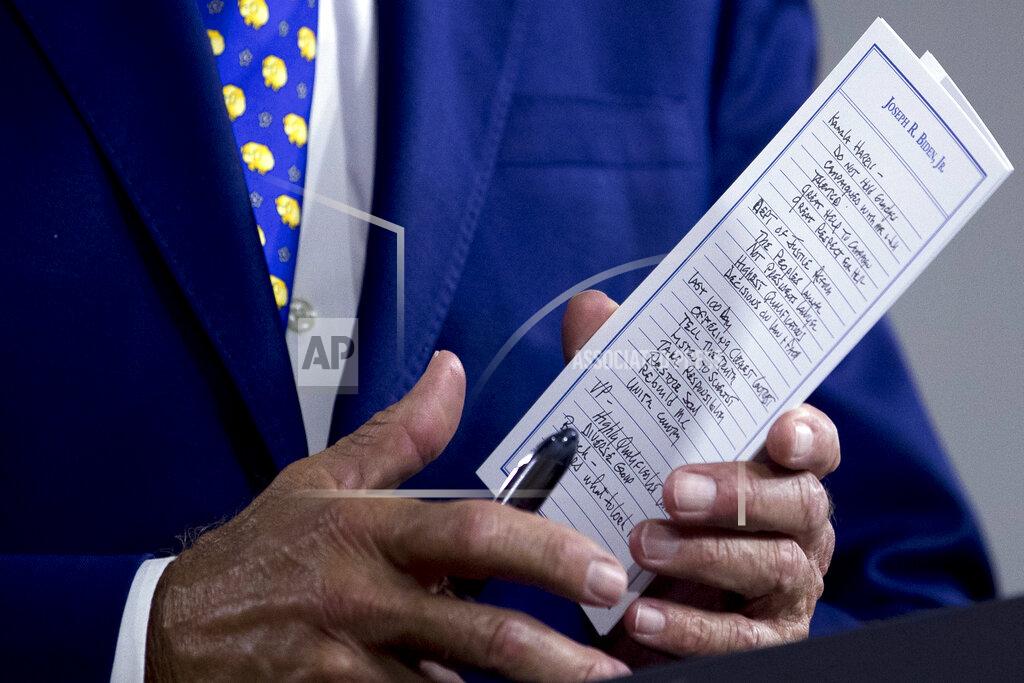 The notes of Democratic presidential candidate former Vice President Joe Biden reference Sen. Kamala Harris, D-Calif., among other things as he speaks at a campaign event at the William "Hicks" Anderson Community Center in Wilmington, Del., Tuesday, July 28, 2020.(AP Photo/Andrew Harnik)