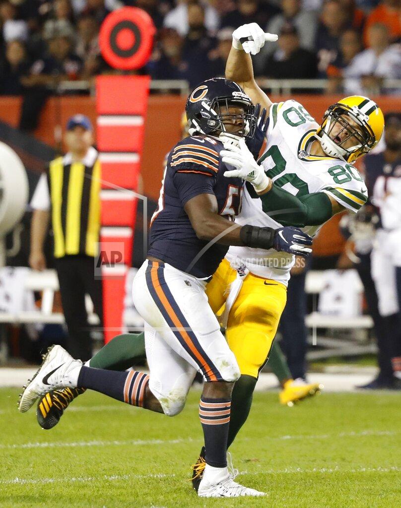 Charles Rex Arbogast Chicago Bears' Roquan Smith is called for pass interference on Green Bay Packers' Jimmy Graham during the second half of an NFL football game Thursday, Sept. 5, 2019, in Chicago. (AP Photo/Charles Rex Arbogast)
