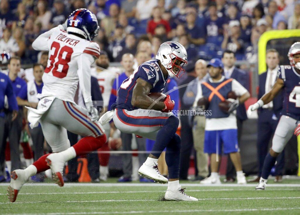 Elise Amendola New England Patriots wide receiver Demaryius Thomas, right, runs from New York Giants defensive back Henre' Toliver (38) after catching a pass in the first half of an NFL preseason football game, Thursday, Aug. 29, 2019, in Foxborough, Mass. (AP Photo/Elise Amendola)