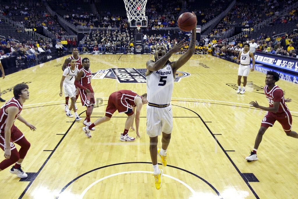 Charlie Riedel Missouri forward Mitchell Smith (5) shoots during the first half of an NCAA college basketball game against Oklahoma, Tuesday, Nov. 26, 2019, in Kansas City, Mo. (AP Photo/Charlie Riedel)