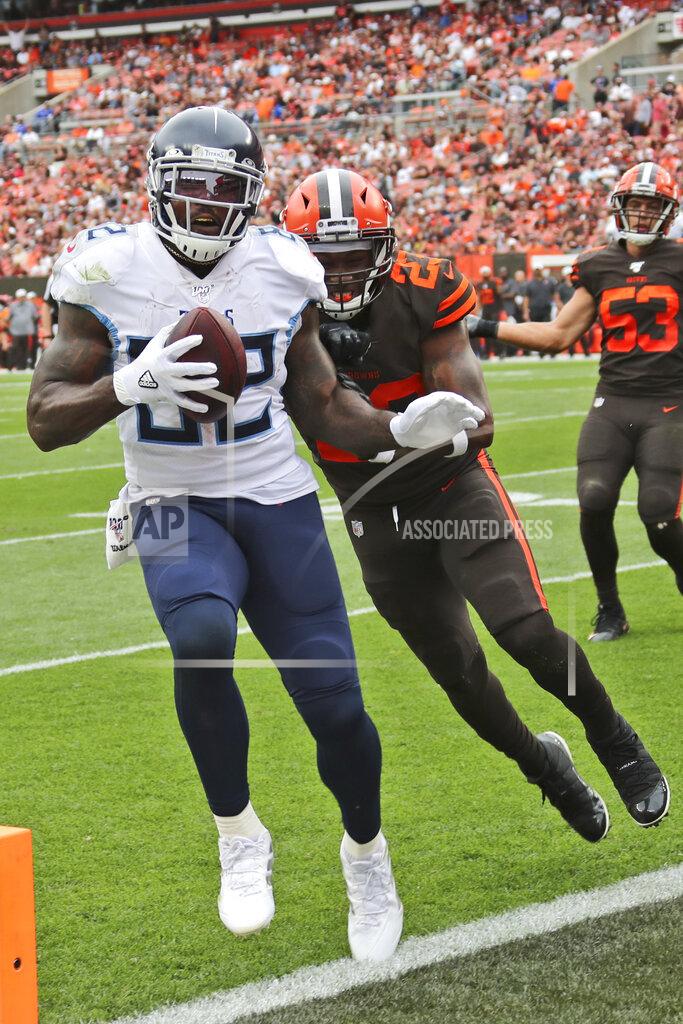 Ron Schwane Tennessee Titans tight end Delanie Walker (82) scores a touchdown ahead of Cleveland Browns strong safety Damarious Randall (23) during the second half in an NFL football game Sunday, Sept. 8, 2019, in Cleveland. (AP Photo/Ron Schwane)