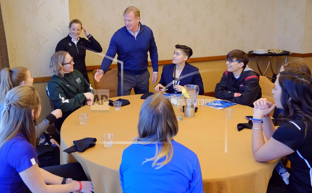 FILE - In this Feb. 26, 2019, file photo, NFL Commissioner Roger Goodell greets Saskatchewan equipment manager/team administrator Andrea Eccleston and other participants, including Bear Lake High School offensive coordinator Sam Mullet, right wearing glasses, at the NFL Women's Forum held in Indianapolis. According to 2019 research by the Institute for Diversity and Ethics in Sport, there are 73 female vice presidents throughout the league. The NFL’s COO is Maryann Turcke. One-third of the working force in NFL offices is made up of women. (AP Photo/AJ Mast, File)