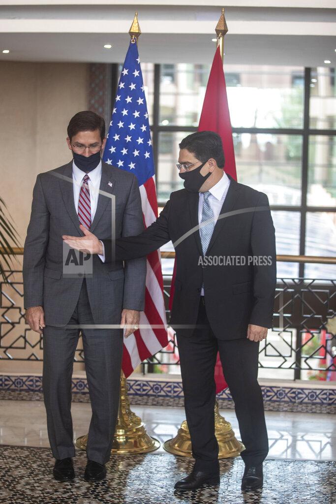 Mosa'ab Elshamy US Secretary of Defense Mark Esper, left, is received by Moroccan Foreign Minister Nasser Bourita, right, in Rabat, Morocco, Friday, Oct. 2, 2020. The visit is part of US Defense Secretary Mark Esper's North Africa tour and is his first visit to Africa as defense secretary. (AP Photo/Mosa'ab Elshamy)