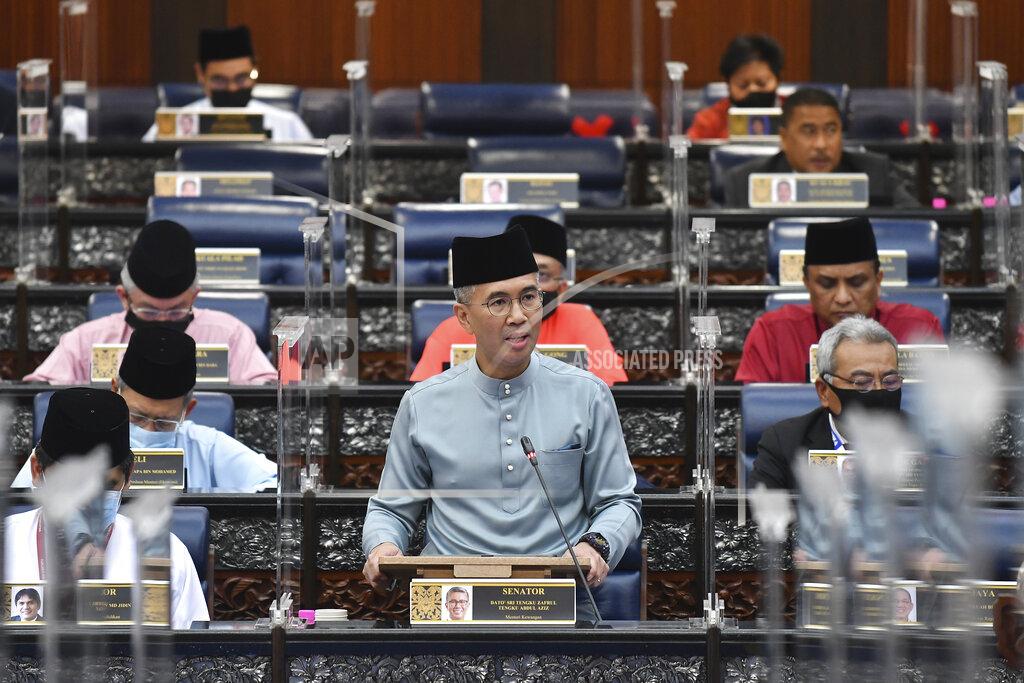 Vincent Thian Malaysia's Finance Minister Zafrul Aziz delivers the 2021 budget speech at parliament in Kuala Lumpur, Malaysia, Friday, Nov. 6, 2020. (AP Photo)
