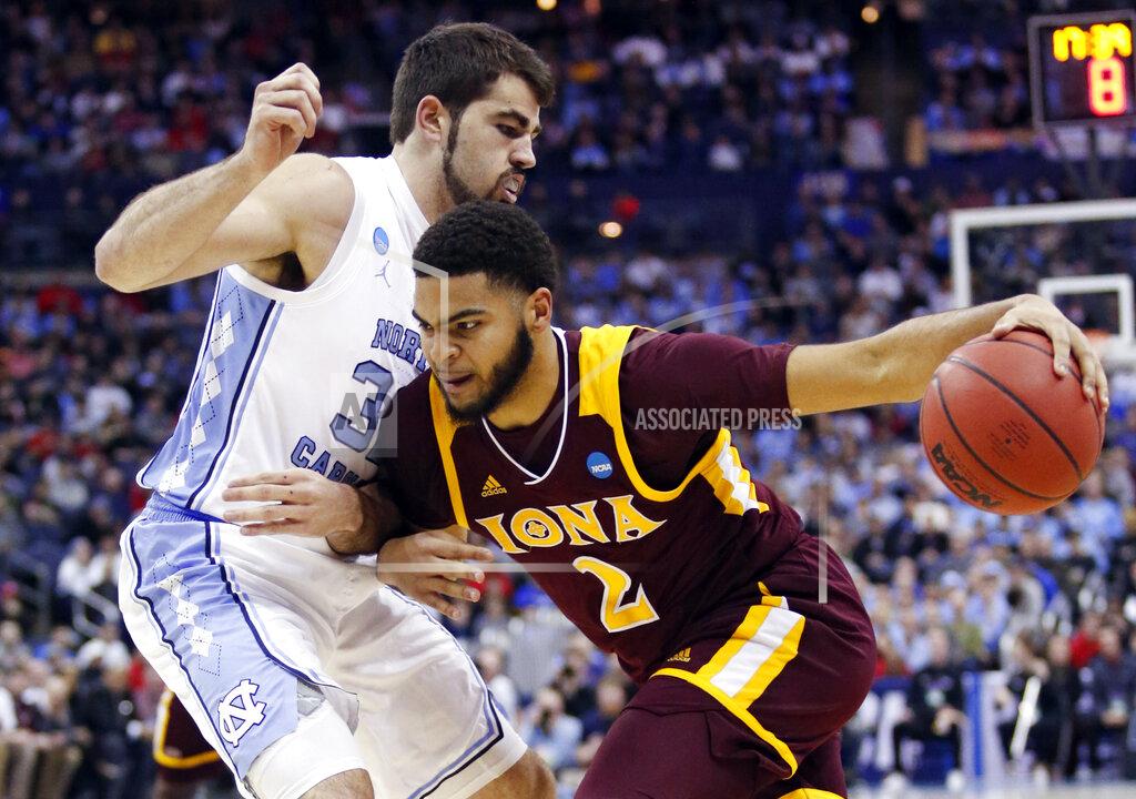 Paul Vernon Iona's E.J. Crawford (2) drives past North Carolina's Luke Maye (32) in the first half during a first round men's college basketball game in the NCAA Tournament in Columbus, Ohio, Friday, March 22, 2019. (AP Photo/Paul Vernon)