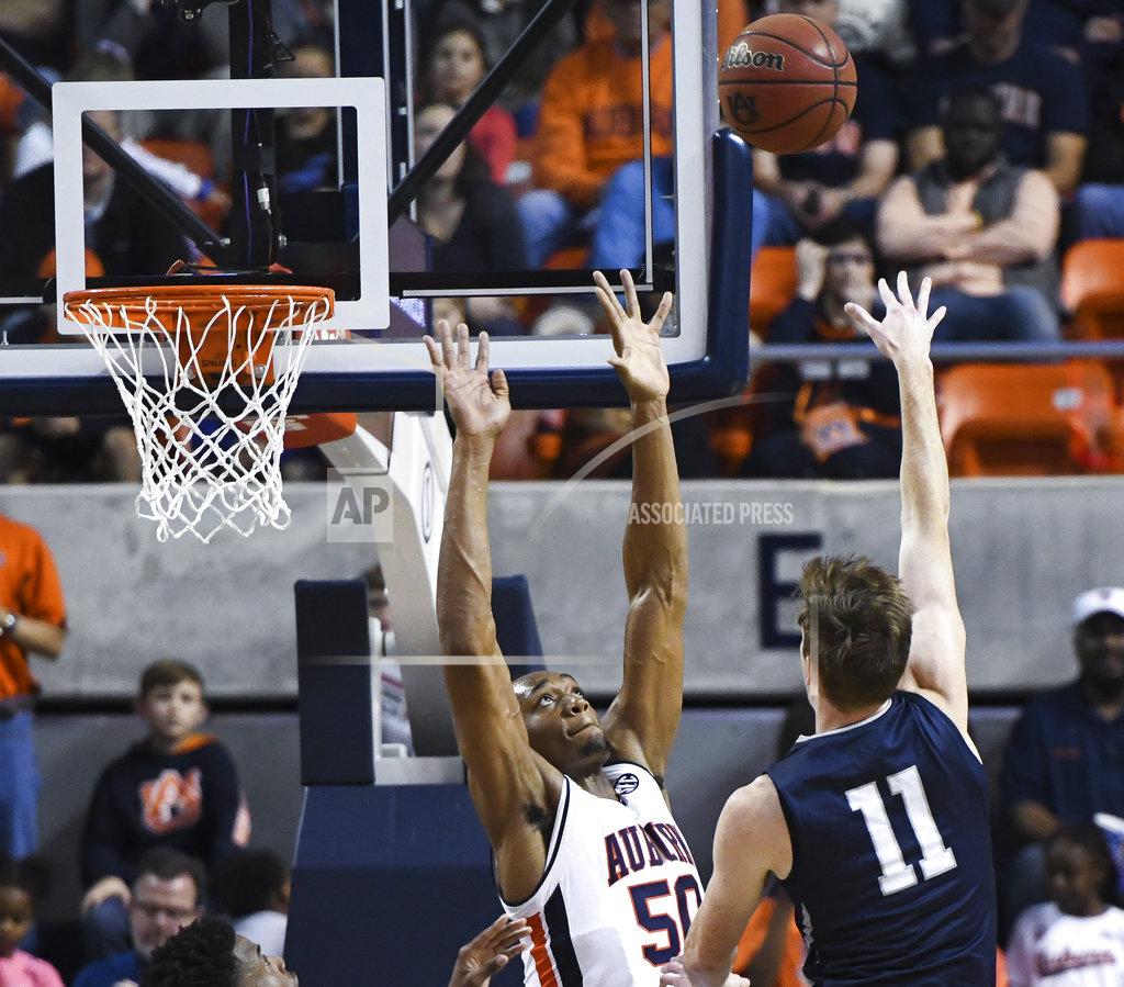 Julie Bennett North Florida player Garrett Sams (11) shoots over Auburn center Austin Wiley (50) during the second half of an NCAA college basketball game Saturday, Dec. 29, 2018, in Auburn, Ala. (AP Photo/Julie Bennett)