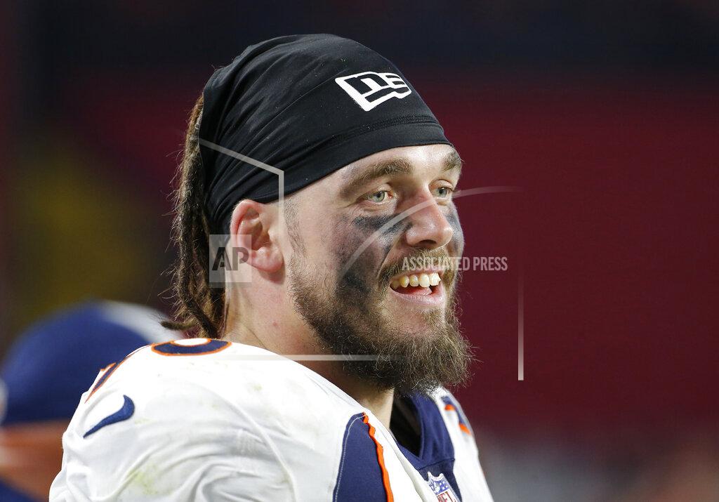 FILE - In this Oct. 18, 2018, file photo, Denver Broncos defensive end Derek Wolfe looks on during an NFL football game against the Arizona Cardinals in Glendale, Ariz. Wolfe figured he missed yet another chance to join the Baltimore Ravens when the team reached agreement last month on a three-year contract with free agent defensive lineman Michael Brockers. After the deal fell through, Wolfe immediately contacted his agent and insisted that he get in touch with the Ravens. Not long after that, the longtime tackle with the Broncos received a one-year pact with Baltimore.(AP Photo/Rick Scuteri, File)