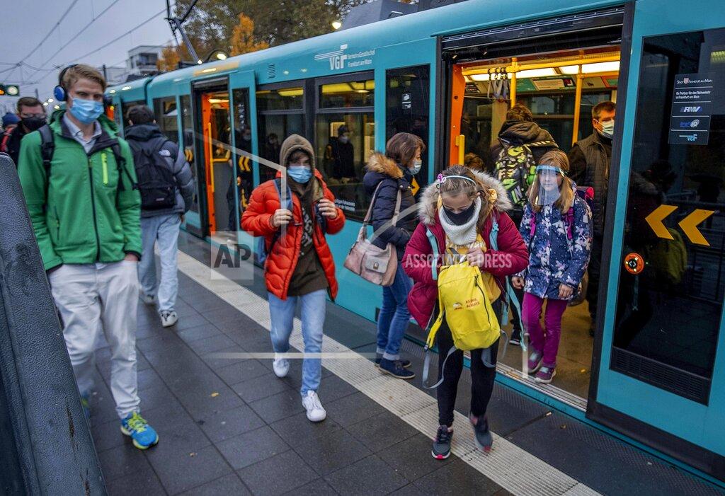 Michael Probst Students wear face masks as they leave a subway in Frankfurt, Germany, Wednesday, Oct. 28, 2020. (AP Photo/Michael Probst)