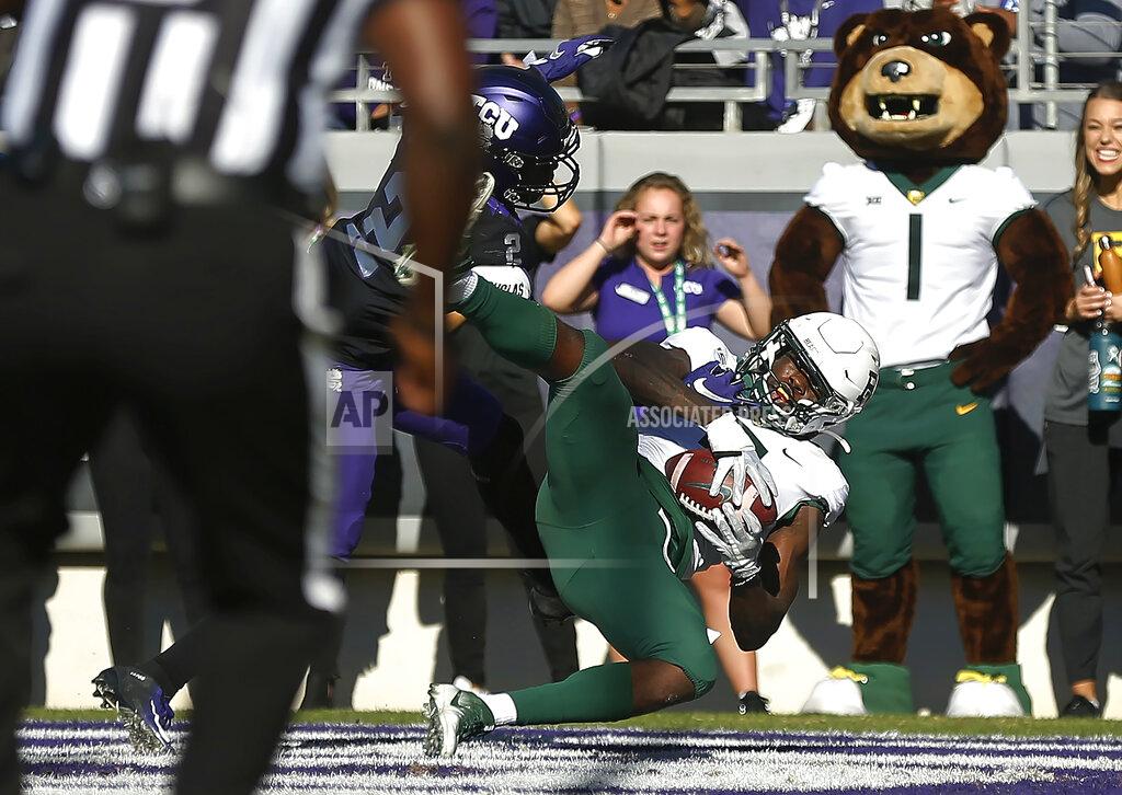 Ron Jenkins Baylor wide receiver Denzel Mims (5) catches a touchdown pass as TCU cornerback Kee'yon Stewart (2) defends during the third overtime of an NCAA college football game, Saturday, Nov. 9, 2019, in Fort Worth, Texas. Baylor won 29-23 in triple overtime. (AP Photo/Ron Jenkins)