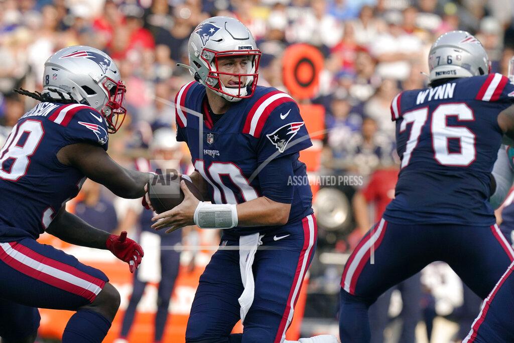 New England Patriots quarterback Mac Jones (10) looks to pass after faking a hand off during the first half of an NFL football game against the Miami Dolphins, Sunday, Sept. 12, 2021, in Foxborough, Mass. (AP Photo/Steven Senne)