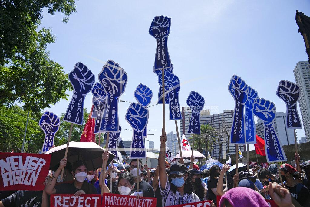 Aaron Favila Protesters hold slogans during a rally against presidential frontrunner Ferdinand "Bongbong" Marcos and running mate Sara Duterte, daughter of the current president, during a rally in Pasay, Philippines, Friday, May 13, 2022. Allies of the Philippines' presumptive next president, Marcos Jr., appear set to strongly dominate both chambers of Congress, further alarming activists after the late dictator's son scored an apparent election victory that will restore his family to the seat of power. (AP Photo/Aaron Favila)