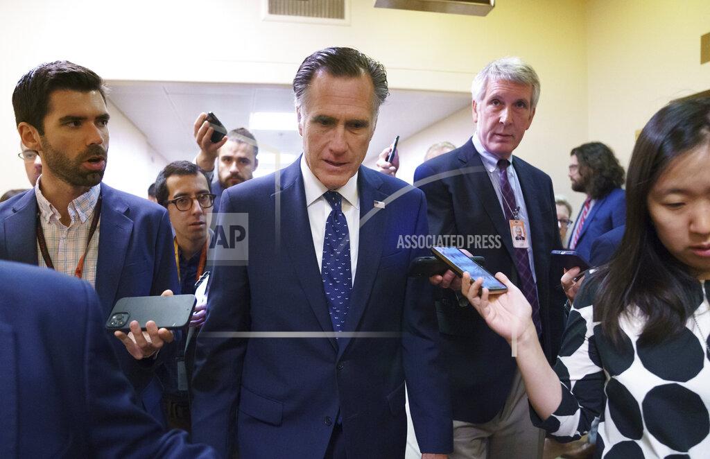 J. Scott Applewhite Sen. Mitt Romney, R-Utah, is surrounded by reporters as he walks to the Senate chamber for votes, at the Capitol in Washington, Thursday, June 10, 2021. Sen. Romney is working with a bipartisan group of 10 senators negotiating an infrastructure deal with President Joe Biden. (AP Photo/J. Scott Applewhite)