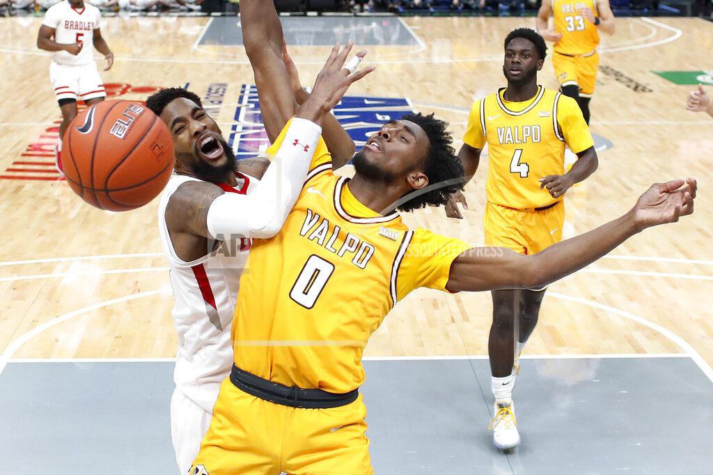Jeff Roberson Bradley's Elijah Childs, left, loses control of the ball as Valparaiso's Javon Freeman-Liberty (0) defend during the second half of an NCAA college basketball game in the championship of the Missouri Valley Conference men's tournament Sunday, March 8, 2020, in St. Louis. Bradley won 80-66. (AP Photo/Jeff Roberson)